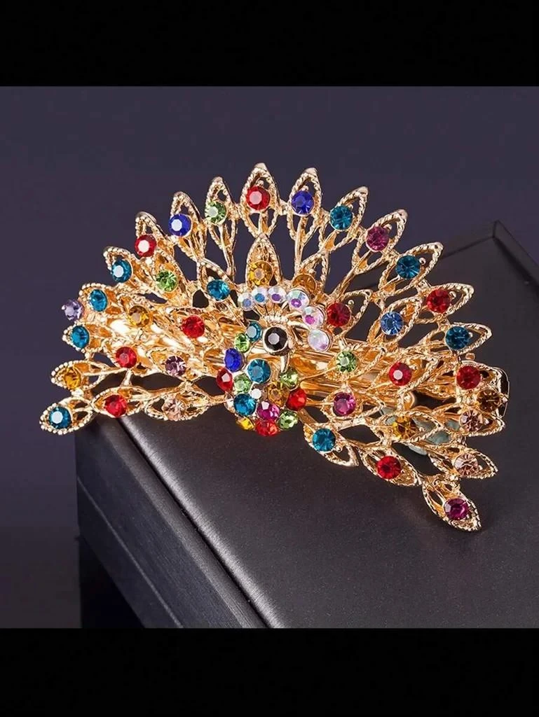 Barrette dorée et cristal en forme de paon